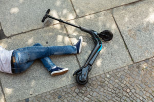 Pedestrian Accident Lawyer West Lafayette, IN - Unconscious Man Lying On Street After Accident Electric Scooter